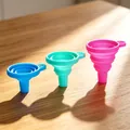 Close-up of collapsible silicone funnels in vibrant blue, teal, and pink for kitchen use - Extra Large Without Packaging / Blue