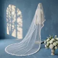 Detailed view of a long double-layer bridal veil with elegant 3D floral and pearl decorations - Off White