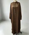 Brown striped stand collar long shirt and wide-leg pants set shown on mannequin - Striped Jacket And Trousers Suit - Brown