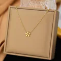 Elegant 18k gold plated flower bracelet with central rhinestone on tan display box. - Flower White Rhinestone Necklaces in Gold Color