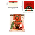 Exquisite 3D pop-up Christmas greeting card featuring Santa by the fireplace, 15x15cm size - Music Christmas Fireplace