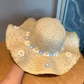 Summer wide brim straw sun hat with white and blue crochet flower decorations - Cloud Beige