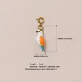 Detailed bird enamel charm pendant in stainless steel with 24mm height measurement - White Bird