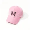 Detail shot of a cozy pink faux mink fur baseball cap featuring a rhinestone letter M - Pink Letter M / Adult, Hat Circumference 58cm Adjustable