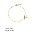 Gold titanium steel bow choker necklace featuring a flat snake chain and extension link - Necklace (XKN0605) / Gold