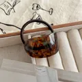 Elegant tortoiseshell semi-circular hair tie with durable brown elastic band. - Lake Blue Brown