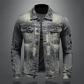 Close-up detail of heavy distressed denim jacket featuring vintage patches and worn texture - Antique Silver