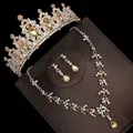 Close-up view of a luxury champagne crystal bridal crown necklace and earring jewelry set - Stud Pin Style / Three-Piece Set / Gold (Yellow Rhinestone)