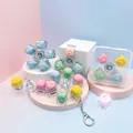 Detailansicht des Katzenpfoten-Zappel-Spinners mit mechanischer Taste und LED-Effekt - Kartonverpackung / 3-Tasten Katzenpfote Fidget Spinner mit Licht