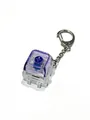 Close-up of a glowing mechanical switch keychain for stress relief with purple keycap - Single Keycap / Multicolor / Purple