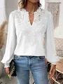 Close-up detail of a white V-neck long sleeve casual top with elegant lace patterns. - S / Tops / White
