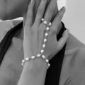 Minimalist baroque pearl finger bracelet with delicate silver link chain jewelry. - Baroque Artificial Pearl Linked Style / Silver