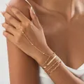 Elegant gold multi-layer finger chain bracelet featuring snake and paperclip links. - Mixed Multi-layer Chain Linked Style / Gold
