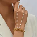 Minimalist gold chain hand harness with white pearl strands and integrated finger ring - Cuban Chain with Double Artificial Pearl Linked Style / Gold