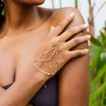 Elegant gold multi-layer hand chain slave bracelet jewelry shown on female model's hand - Multi-layer Intertwined Chain Linked Style / Gold