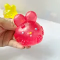Translucent pink glitter rabbit squishy stress relief toy held in hand for sensory play - Basic Style / Pink