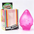 Pink glitter drop-shaped squishy toy with colorful rainbow themed packaging detail - Color Box Packaging / Pink