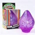 Detailed view of a purple glitter drop squishy toy with a splash base and rainbow box - Color Box Packaging / Purple