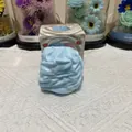 Close-up of a blue cream-shaped squishy toy for stress relief and relaxation - Cream Roll / Blue