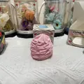 Detailed view of pink cream swirl slow rebound squishy toy with its gift packaging box - Cream Roll / Pink
