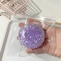 Pelota antiestrés creativa con cuentas de gel moradas en una bolsa transparente - Bola de Luz de Luna Púrpura