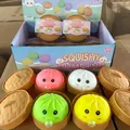 Macro view of colorful squishy dumpling toys with bubble features in mini steamer boxes - Bubble Spitting Dumpling