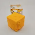 Detailed view of yellow cheese cube slow rebound stress relief toy with packaging box - Cheese Cube Shape / Yellow