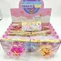 Detailed view of cat paw shaped glitter squeeze toys in colorful retail display box - Light-up Cat Paw