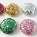 Close-up detail of five colorful glitter-filled bun squishy toys for stress relief in a variety of hues - 8.5cm Glitter Squishy With Steamer / Pink