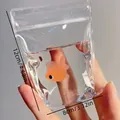 Detailed view of orange goldfish water bag stress relief toy, 12cm x 8cm dimensions - Goldfish Bag Shape