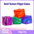 Close-up of four colorful water ripple pattern cube squishy toys for stress relief. - Marble Swirl Style / 5cm Size