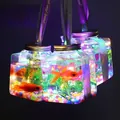 Detailed view of LED glowing fish jars with colorful lights and decorative ribbons - Glowing Fish Tank Kit