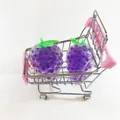 Purple grape-shaped squishy toys in a miniature pink shopping cart for stress relief - Grape (Bead Filling)