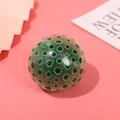 Green patterned TPR squeeze stress ball for anxiety relief and sensory play - 1 Piece / Green Pulp with Black Beads