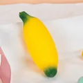 Creative banana-shaped stress relief squeeze toy with soft flour filling in bright yellow - Banana (Flour Filling)