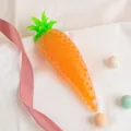 Orange carrot-shaped sensory stress relief squeeze toy with inner beads on white fabric - Carrot (Bead Filling)