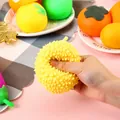 Detail view showing the soft texture of a durian-shaped squishy stress relief toy being squeezed - Durian (Flour Style/Mixed) / 1 Piece