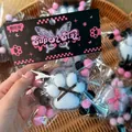 Close-up of fuzzy cat paw squishy toy in stylish pink and black packaging - Card Head PVC Bag / Flocked Black White Dot Bow Cat Paw