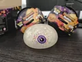 Detailed view of a glittery Halloween eyeball squishy toy with purple iris design. - Horror Eyeball