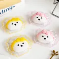 Quatre adorables jouets squishy tête d'ours avec des nœuds colorés sous sachets. - Jouet Anti-stress / Tête d'Ours avec Nœud