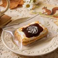 Jouet de compression en forme de biscuit au café réaliste dans un emballage plastique - Jouet Anti-stress / Biscuit au Café