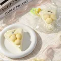 Detail of triangle cake squishy toy made of soft food-grade silicone for stress relief - Squishy Toy / Cloud Cream Triangle Cake