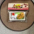Detailed close-up showing the food-shaped squeeze toy set in its original packaging - Fritters And Buns Platter Style