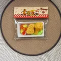 Detail shot of simulated fast food squeeze toy nuggets and chicken leg in packaging - Fried Chicken And Fries Style