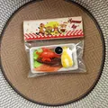 Detailed macro shot of food-shaped squeeze toy set including lobster and salmon in clear packaging - Lobster Egg Platter Style