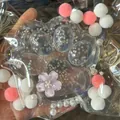 Detailed view of giant cat paw squishy toy with star glitter inside packaging. - 11-12cm Oversized / Transparent (Sequins)