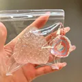 Close-up detail of a large pink glitter strawberry stress relief squishy toy in clear bag - Crystal Glitter Strawberry Squishy / Crystal Pink