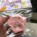 Detailed close-up of a pink starry cat paw squeeze toy inside its original packaging - Starry Sky Pink Cat Paw