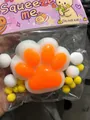 Macro primo piano di un giocattolo a zampa di gatto arancione e bianco da 7 cm antistress - Grande Stile Liscio Arancio E Bianco / Zampa di Gatto Bianca E Arancione (Superficie Liscia)