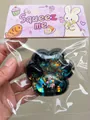 Galaxy cat paw squishy stress relief toy with iridescent sequins and cute packaging - Galaxy Black Cat Paw